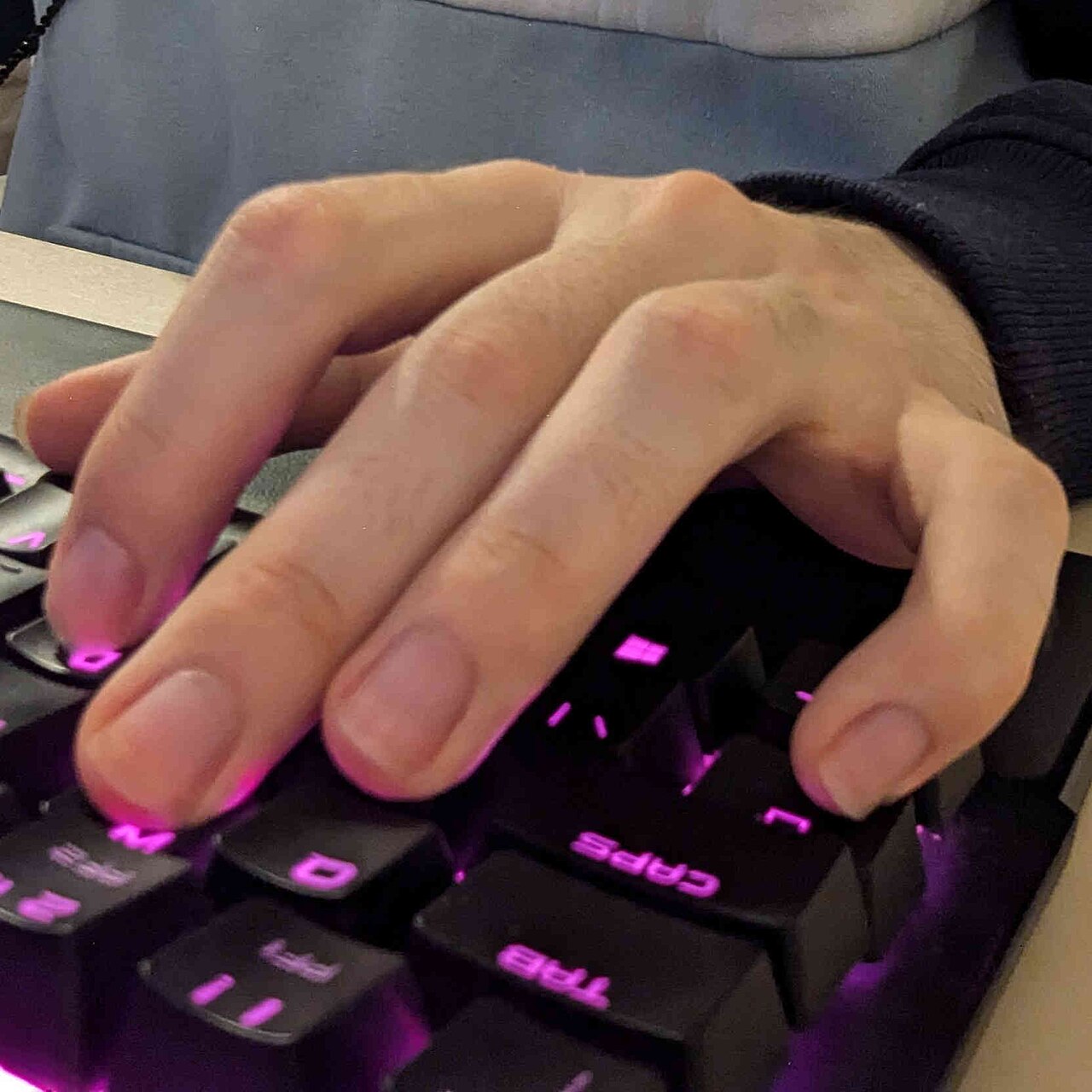 A computer keyboard seen from the front